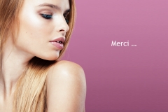 young pretty blonde woman with hairstyle close up and makeup on pink background smiling